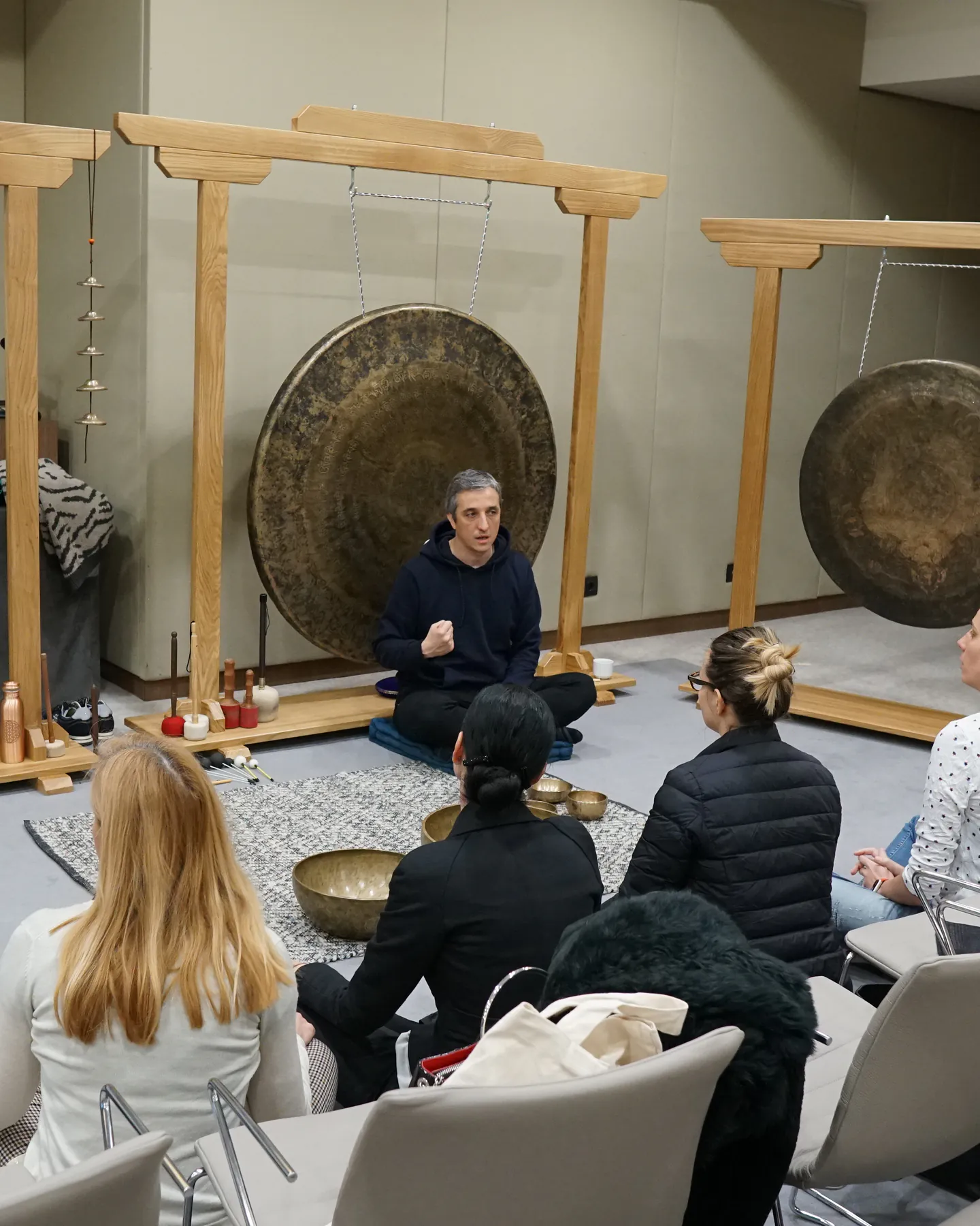 Mladen leading a group sound healing session with a gong setup